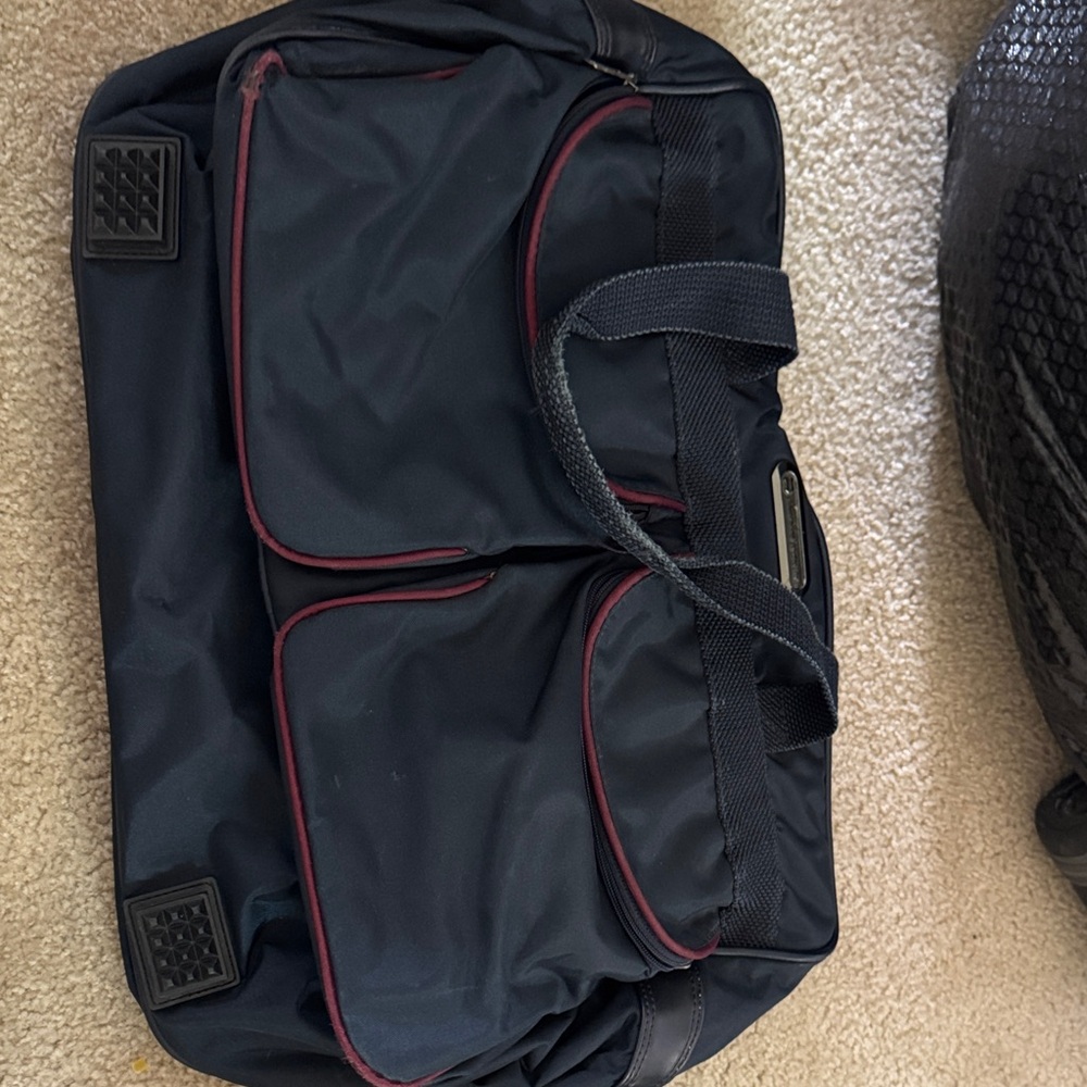 American Tourister Black Duffel Bag with Red Trim